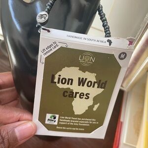 Handmade Black Beaded bracelet with Silver Charm from South Africa